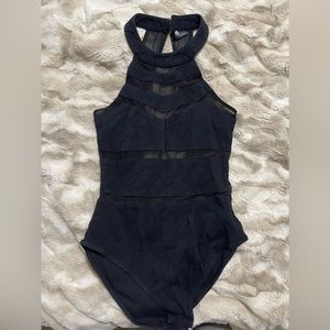 Black mesh cut out body suit, high neck, low back